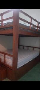 a couple of bunk beds with wooden bunk bedsessions at Gandasari homestay banyuwangi in Banyuwangi +20 photos