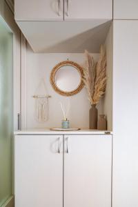 a dressing room with white cabinets and a mirror at MARSEA Resort in Zushi +33 photos