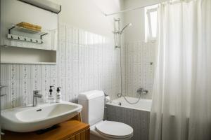 a bathroom with a sink and a toilet and a shower at Luxury Nature Retreat Villa Planchette in Lugano +86 photos