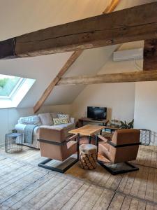 a living room with a couch and a table at BoerLangendijk in Rucphen