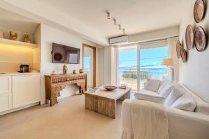a living room with a couch and a table at Apartment with sea view Javea in Jávea