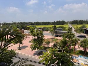 a view of a parking lot with trees and a street at Lala hotel in Phủ Từ Sơn