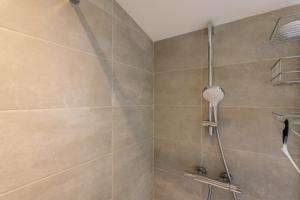 a shower with a glass door in a bathroom at Charmante Maison Vallon pont d'Arc in Vallon-Pont-dʼArc +13 photos