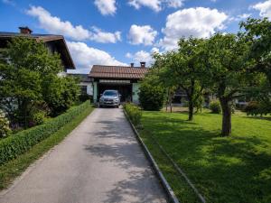 a car parked in front of a house at Apartment Beli in Radovljica
