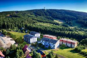 an aerial view of a building on a hill at Visit sauna Klinovec in Loučná pod Klínovcem