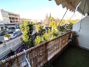 a balcony with a view of a city at Cucuvaya Rithy in Áyios Andónios