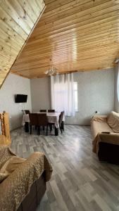 a large room with a table and a dining room at VILLA MEYSARY in Shamakhi