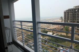 a view of a city from a window at The Sea Princess Hotel in Cox's Bazar