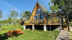 a large wooden house with a large window at Cozy A-Frame Cabin with Private Hot Tub - Chiang Mai in Şelari +19 photos