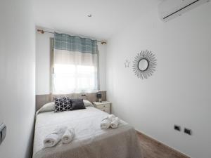 a bedroom with a bed with towels on it at Villa Victor in Riumar +18 photos