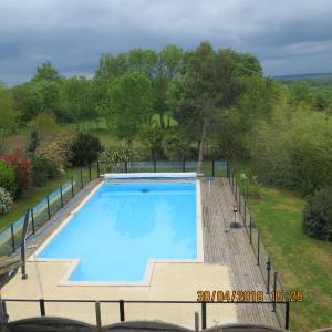 an overhead view of a large swimming pool at chambres nature in La Celle-sous-Gouzon