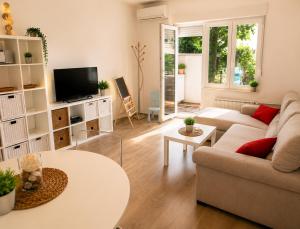 a living room with a couch and a table at Athena in Koper