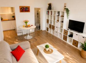 a living room with a couch and a table at Athena in Koper