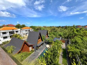 an aerial view of a house with trees at Twinseas Villa in Uluwatu