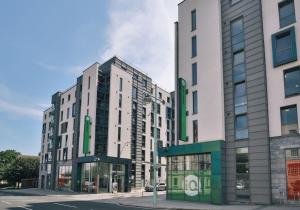 a group of buildings on a city street at Astor House by Pureserviced in Plymouth