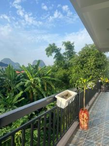 a balcony with a view of the mountains at Tam coc Sylvani Homestay in Vũ Lâm
