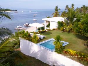 an aerial view of a resort with a swimming pool at The Clifftop Home in Esperanza
