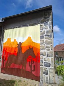 a mural painted on the side of a building at Faugere in Bussières