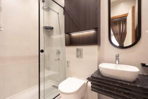 a bathroom with a toilet and a sink and a shower at Malak Palace Cairo Hotel in Cairo +79 photos