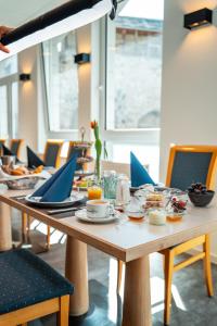 a table with plates of food on top at Wetzlarer Hof Hotel & Restaurant in Wetzlar