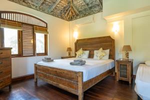 a bedroom with a large bed in a room at Amara Villa in Galle +147 photos