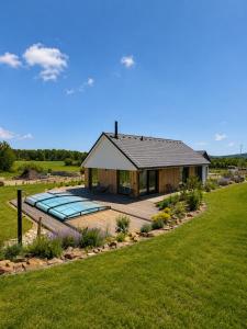 a house with a swimming pool in the yard at Modern House with Private Pool & Terrace in Červená Třemešná