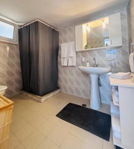 a bathroom with a sink and a shower at Casa Crystallia in Chalkida +27 photos