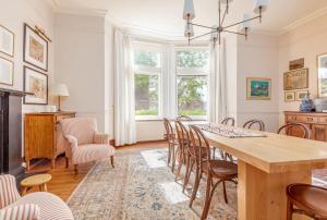 a dining room with a table and chairs at Hazelton Townhouse - Crail in Crail