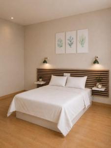 a bedroom with a large white bed with two pillows at Hotel Peña Pintada by Vivere Stays in Lañada