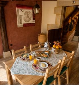 a table with food and fruit on top of it at La Senda del Norte in Cabezón de la Sal