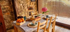 a dining room table with fruit on it at La Senda del Norte in Cabezón de la Sal