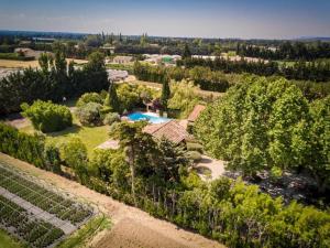an aerial view of a garden with a swimming pool at Mas des 4 fontaines in Robion en Luberon