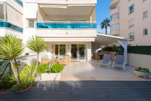 a balcony of a building with chairs and plants at Estrella 2 BA Spaniahome in Albir