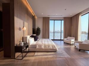 a bedroom with a bed and a living room at Villa 72 RAK in Ras al Khaimah