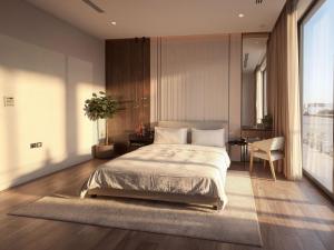 a bedroom with a bed and a desk and a window at Villa 72 RAK in Ras al Khaimah +17 photos