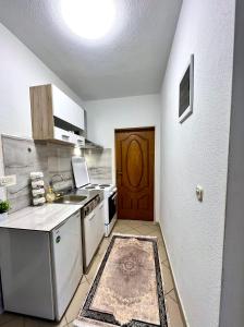 a kitchen with a sink and a counter top at PARIS Luxury Center Apartment STRUGA in Struga