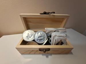 a wooden box filled with clocks on a table at Alcazaba Home in Almería