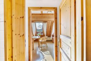 a hallway of a house with a table and a chair at Haus Habbinga in Ovelgönne