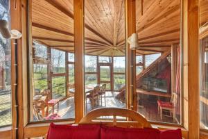a living room with large windows and a fireplace at Haus Habbinga in Ovelgönne
