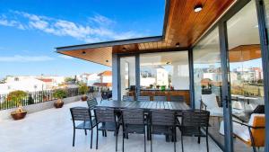 a patio with chairs and a table on a balcony at Arora Home Pleiku in Pleiku