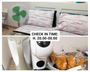 a room with a mixer and a box of croissants at La Perla B & B CHECK IN TIME DA FROM H 20 PM in Ciampino