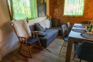 a living room with a couch and a table at Apartma Dobnik in Mozirje