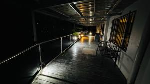 an empty balcony of a building at night at A1 Apartments in Suva