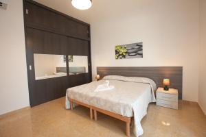 Postel nebo postele na pokoji v ubytování Villa Daniele