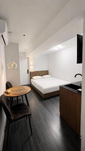 a bedroom with a bed and a table and a table sidx sidx sidx at APETIKO APARTMENTs in Kyiv