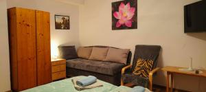 a living room with a couch and a table at Privát Sisi in Hrabušice