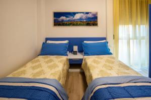 Cama ou camas em um quarto em Affittacamere Le Quattro Stagioni
