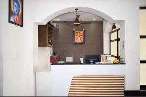 an entrance to an office with a reception desk at Srilakshmi Residency in Tirupati