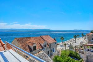 a view of the ocean from a building at Villa Majestic with heated pool and rooftop terrace in Bol
