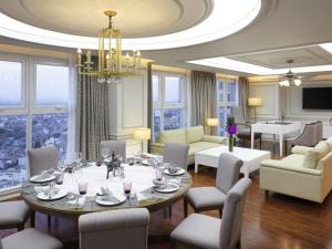 a dining room with a table and chairs at Mercure Hai Phong in Hai Phong